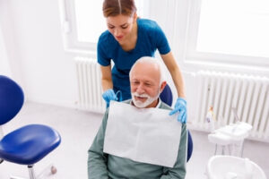 Dental professional working in a modern treatment room